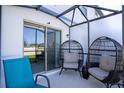 Cozy patio with wicker chairs, perfect for relaxing outdoors at 356 Smugglers Way, Apopka, FL 32712