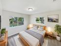 Main bedroom with a plush bed and calming decor at 908 Perkins St, Leesburg, FL 34748