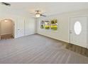 Spacious living room with carpet and large windows at 908 Perkins St, Leesburg, FL 34748