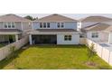 Spacious backyard with screened patio and fenced perimeter at 5653 Oak Knoll Dr, St Cloud, FL 34771