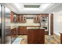 Modern kitchen with stainless steel appliances and granite countertops at 8984 Houston Pl # 103, Orlando, FL 32819