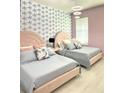 Two twin beds in a pink bedroom with blue and white patterned wallpaper at 2104 Fleming Mist Pl, Kissimmee, FL 34747