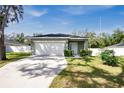 Front view of a house with a driveway at 1780 Grand Oak Dr, Apopka, FL 32703