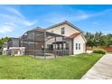 Private screened pool and patio area with seating at 4562 Baleno Ln, Kissimmee, FL 34746