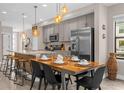 Bright dining area with a wood table and seating for six at 4715 Terra Esmeralda Dr, Kissimmee, FL 34746