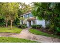 Blue and white townhouse with a walkway and landscaping at 172 Lago Vista Blvd, Casselberry, FL 32707