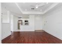 Open concept kitchen and living area with stainless steel appliances and hardwood floors at 3702 Palm Desert Ln # 5431, Orlando, FL 32839