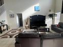 Bright and airy living room with comfortable seating and large TV at 238 Carrera Ave, Davenport, FL 33897