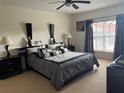 Spacious Primary bedroom with king-size bed and ensuite bathroom at 238 Carrera Ave, Davenport, FL 33897