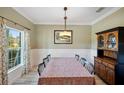 Formal dining room featuring a wood table and hutch at 1511 Orange Valley Rdg, Ocoee, FL 34761