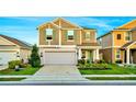 Two-story house with gray siding, green shutters, and landscaping at 1093 Berry Ln, Davenport, FL 33837