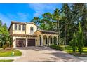 Two-story Mediterranean home with a two car garage at 600 Via Chris Ct, Debary, FL 32713