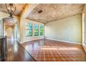 Spacious living room featuring hardwood floors and decorative ceilings at 600 Via Chris Ct, Debary, FL 32713