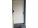 White front door with keyless entry and two door knobs at 4721 Watch Hill Ct, Orlando, FL 32808