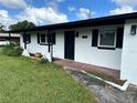 Ranch home with black and white exterior at 5937 Colchester Dr, Orlando, FL 32812