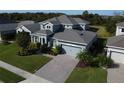 Two-story house, gray roof, paver driveway, and a landscaped yard at 4813 Terra Sole Place, St Cloud, FL 34771