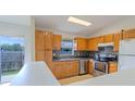 Efficient kitchen with ample cabinet space at 5631 La Joya Ct, Orlando, FL 32808