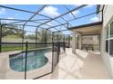 Screened-in pool with a patio, offering a private outdoor space for relaxation at 3149 Jade Tree Pt, Oviedo, FL 32765