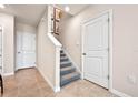 Interior staircase with carpet runner and neutral walls at 384 Preston Cove Dr, Saint Cloud, FL 34771