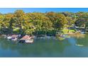 Aerial of waterfront home with boat dock at 1900 W Fawsett Rd, Winter Park, FL 32789