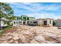 Modern house under construction with block walls and a large lot at 10345 Hart Branch Cir, Orlando, FL 32832
