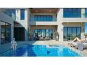 Resort-style pool and spa with patio furniture at 10345 Hart Branch Cir, Orlando, FL 32832