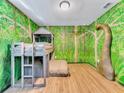 Jungle-themed bedroom with bunk beds at 1465 Belle Terre Rd, Davenport, FL 33896