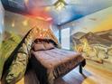 Volcano-themed bedroom with mural at 1465 Belle Terre Rd, Davenport, FL 33896