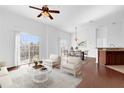 Bright living room with hardwood floors and access to balcony at 3010 San Jacinto Cir # 3010, Sanford, FL 32771