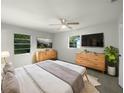 Main bedroom with a king-size bed and ample natural light at 46 Columbine Trl, Debary, FL 32713