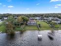 Lakefront property with a private dock and spacious backyard at 6019 Linneal Beach Dr, Apopka, FL 32703
