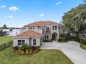 Two-story house with a large yard and lake view at 6019 Linneal Beach Dr, Apopka, FL 32703