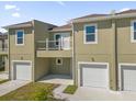 Modern townhouse with attached garage and balcony at 454 Lake Shore Pkwy, Davenport, FL 33896