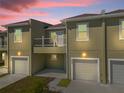 Modern townhouse with attached garage and balcony at 454 Lake Shore Pkwy, Davenport, FL 33896