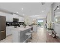 Modern kitchen with island and stainless steel appliances at 3131 Paradox Circle 204 # 204, Kissimmee, FL 34746