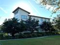 Side view showcasing the home's clean lines and landscaping at 8140 Mistral Dr, Orlando, FL 32827