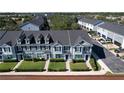 Community of townhouses viewed from above, showing building layout and landscaping at 643 Underwood Cv, Casselberry, FL 32707