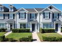 Gray townhome with navy blue door and well maintained landscaping at 643 Underwood Cv, Casselberry, FL 32707