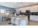 Modern kitchen with granite countertops and stainless steel appliances at 900 Las Fuentes Dr, Kissimmee, FL 34746