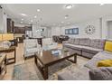 Spacious living room with a large sectional sofa and coffee table at 8832 Macapa Dr, Kissimmee, FL 34747