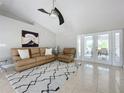 Bright living room featuring comfortable seating and access to a relaxing patio at 790 Silhouette Ct, Longwood, FL 32750