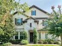 Two-story house with stone accents and a large front door at 8426 Morehouse Dr, Orlando, FL 32836