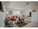 Bright and airy living room with mid-century modern furniture at 315 E St, Lake Wales, FL 33853