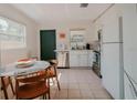 Modern kitchen with white cabinets and stainless steel appliances at 315 E St, Lake Wales, FL 33853