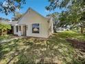 House exterior showcasing a side view with green lawn and trees at 101 Candlewick Ct, Sanford, FL 32771