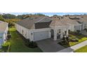 One-story house featuring a gray exterior, gray roof, and covered front porch at 2071 Limestone Trl, Kissimmee, FL 34747