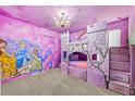 Princess-themed bedroom with a castle bunk bed and mural at 1473 Moon Valley Dr, Davenport, FL 33896