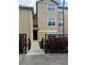 Exterior view of a two-story condo building with a walkway and landscaping at 413 Summit Ridge Pl # 209, Longwood, FL 32779