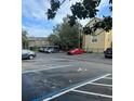 Parking lot with available parking spaces for residents at 413 Summit Ridge Pl # 209, Longwood, FL 32779