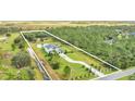 Aerial view of the property, showing the house and surrounding land at 4001 Ainsley Ave, Orlando, FL 32833